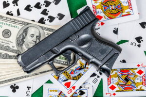 Image of a gun and money, Marco Verch via Flickr
