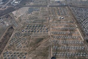 A large array of fighter jets dotted throughout the largest aircraft storage and preservation facility in the world